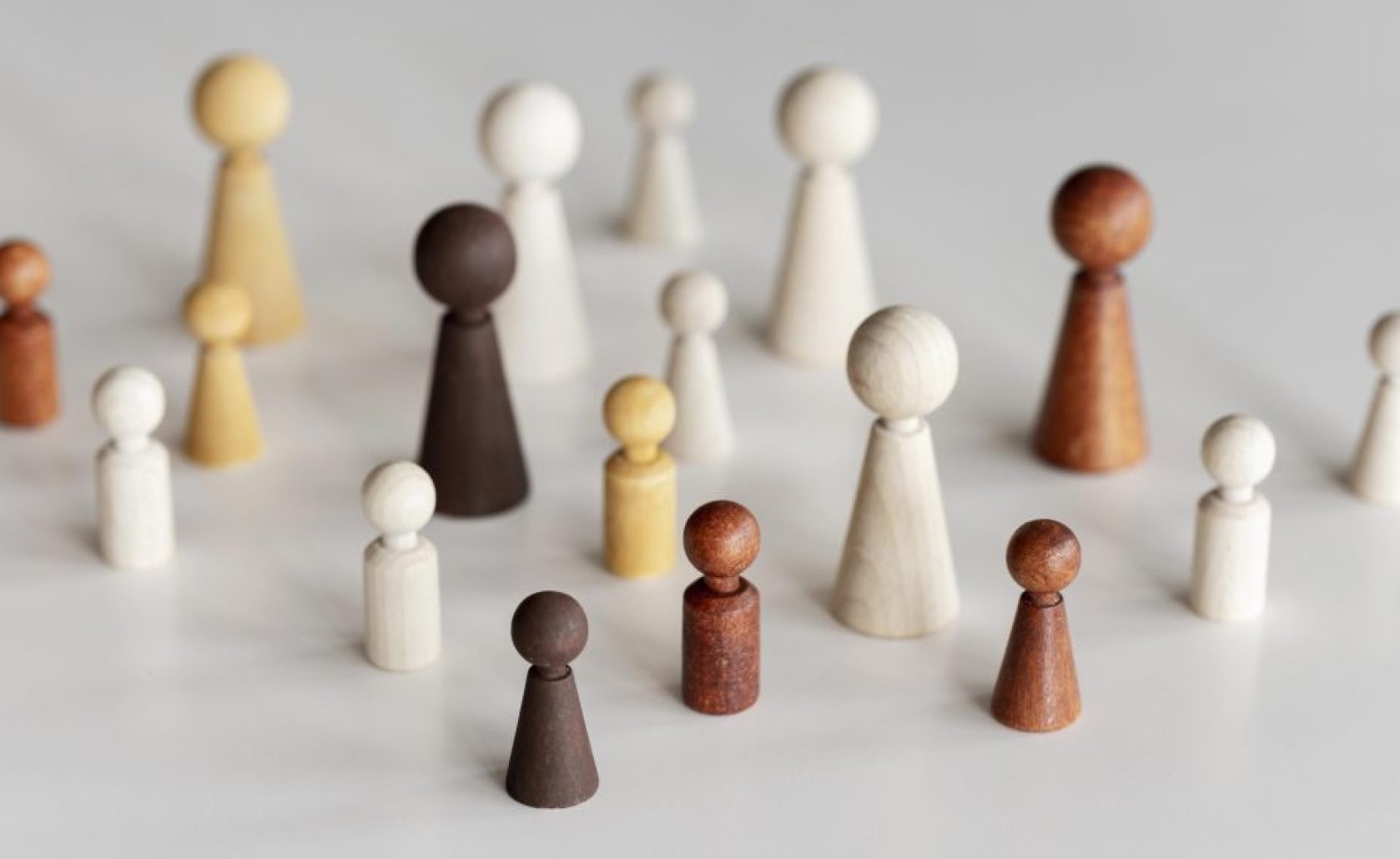 high-view-diverse-wooden-characters-inclusion-concept
